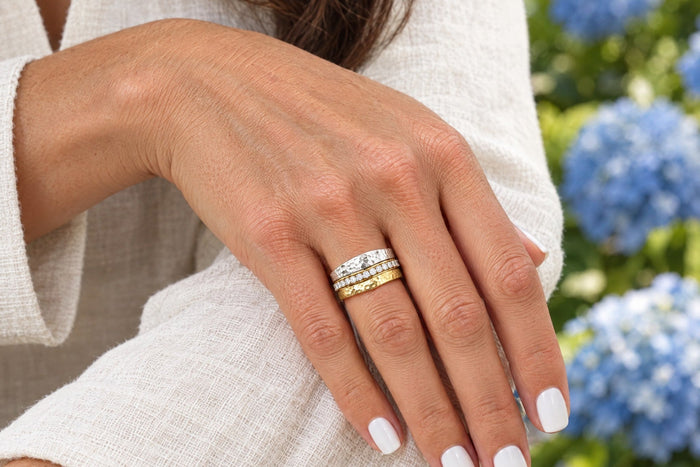 Golden Hour stacking rings worn as a bridal ring stack