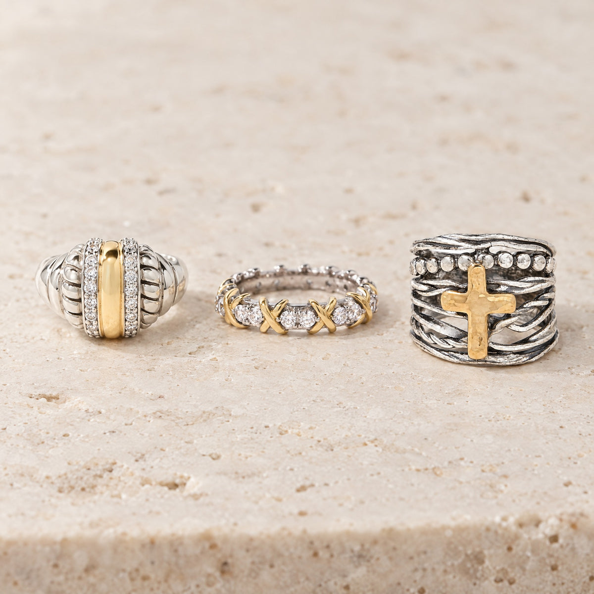 Idalia, Giana and Abby Cross rings on travertine