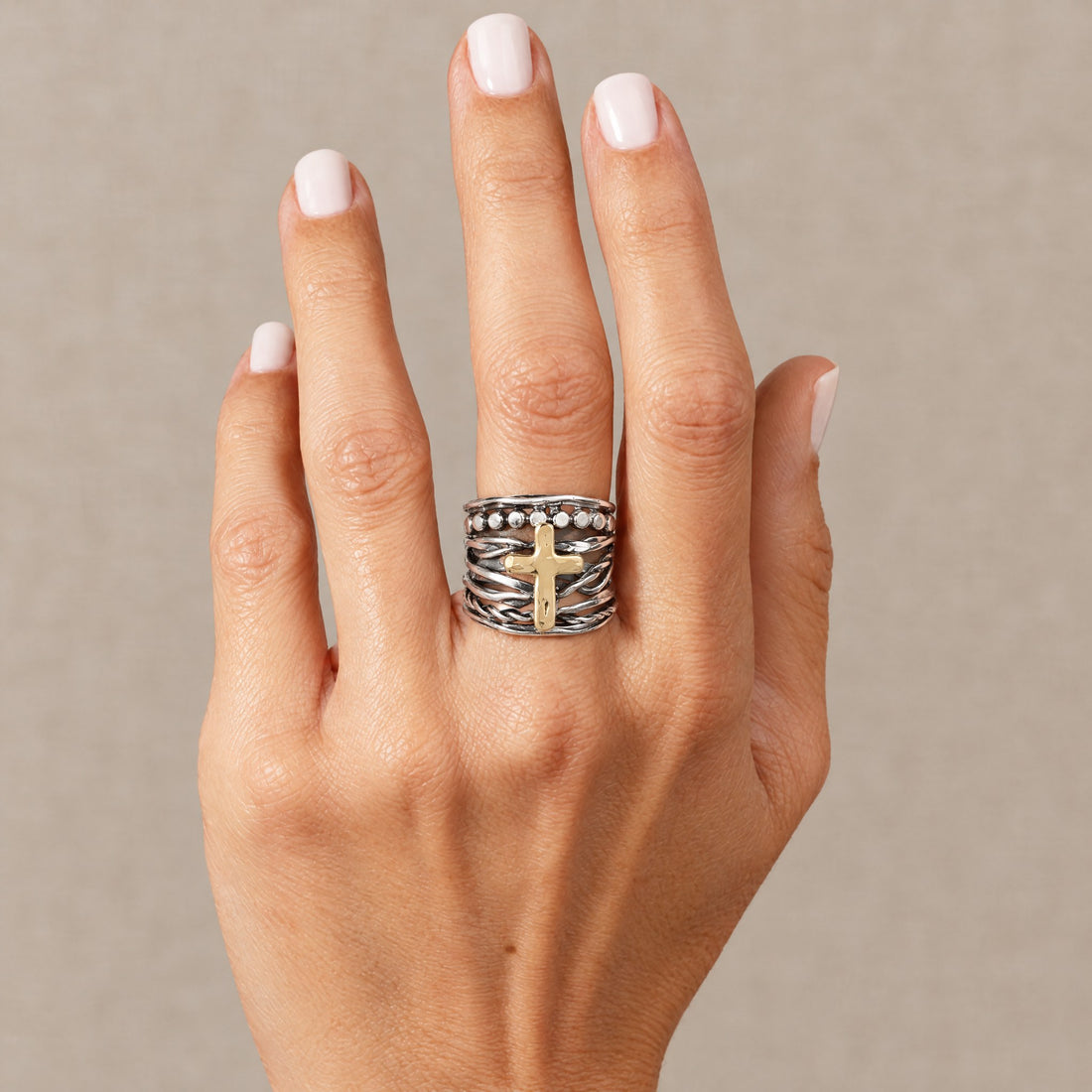 Abby Cross Ring worn, hand raised