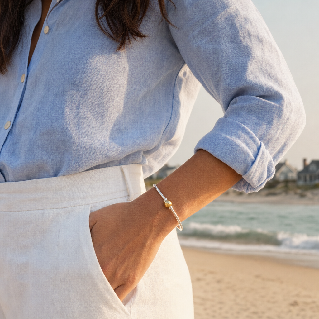 Coastal Ball Bracelet in Sterling Silver with 14k Gold Filled Ball, worn by a model, Ideaure photo