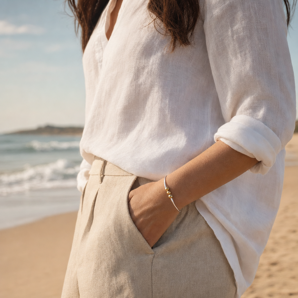 Coastal Triple Ball Bracelet in Sterling Silver with 14k Gold Filled Balls, worn by a model, Ideaure photo