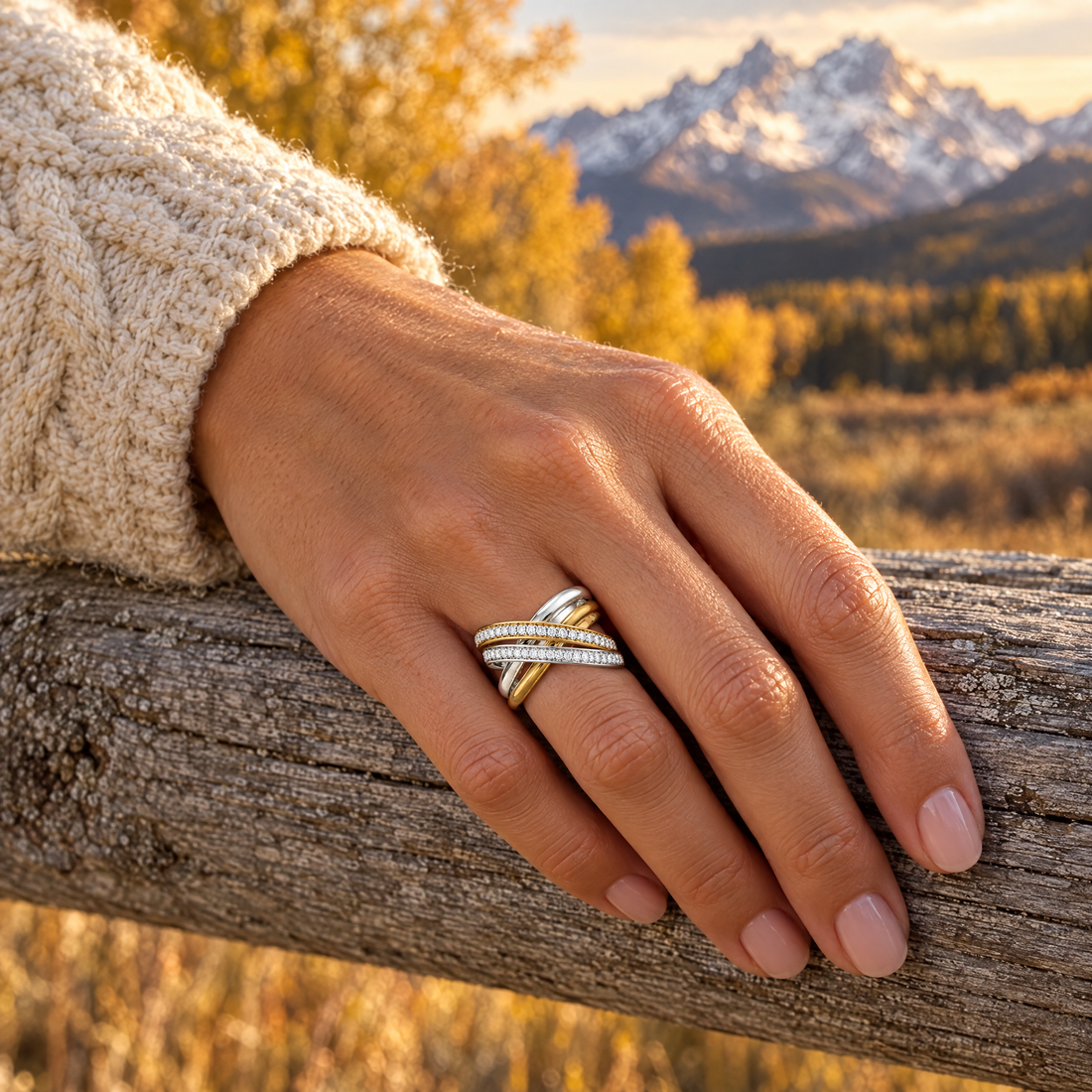 Crossover Pavé Ring worn on a hand, cedar rail and golden aspens, Ideaure photo