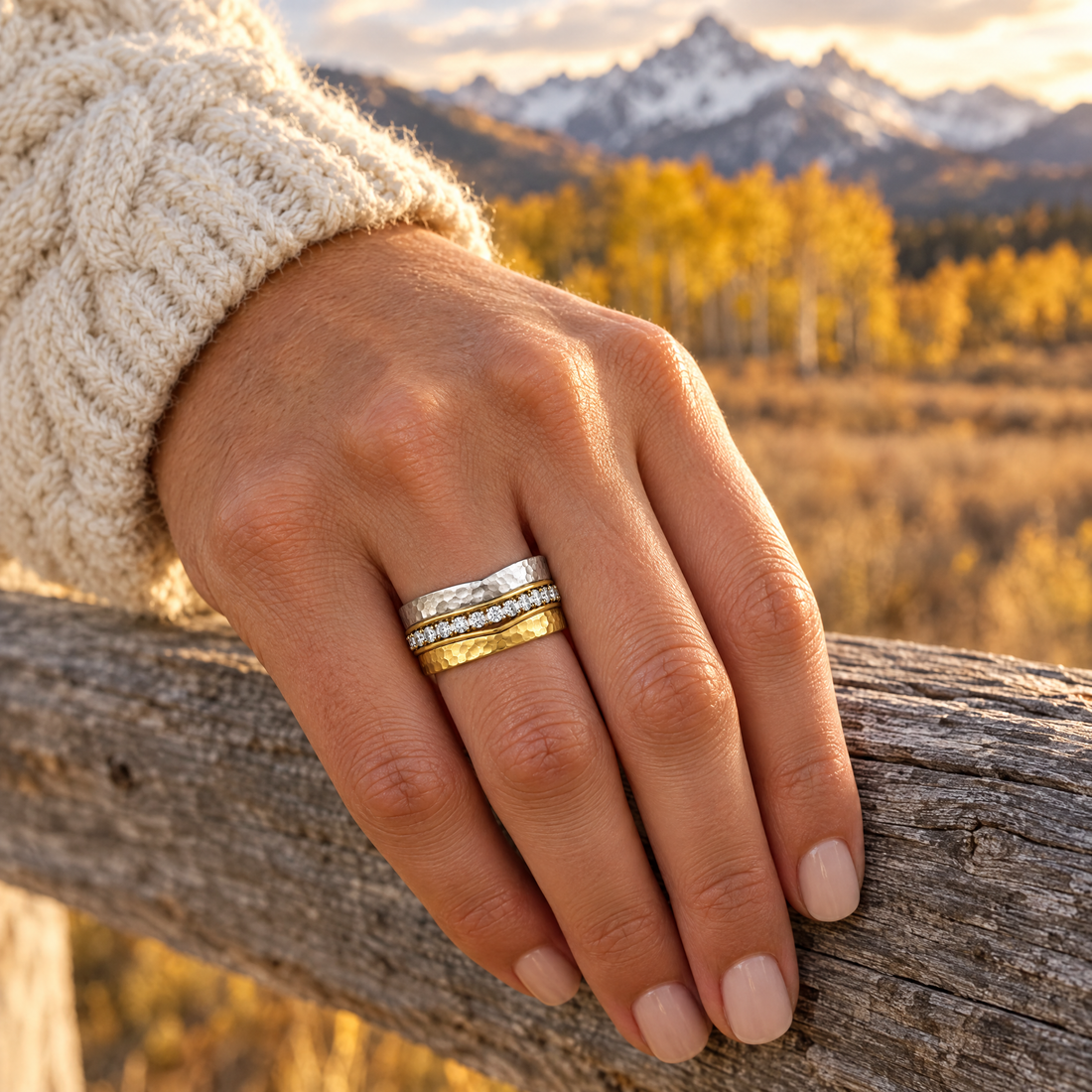 Hammered Wave Stack Ring worn on a hand, cedar rail and golden aspens, Ideaure photo