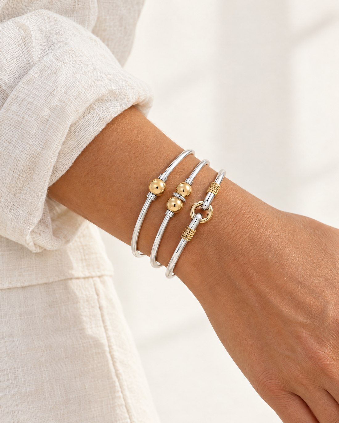 Coastal Ball Bracelet stacked with the Coastal Double Ball Bracelet and Harbor Porthole Hook Bracelet