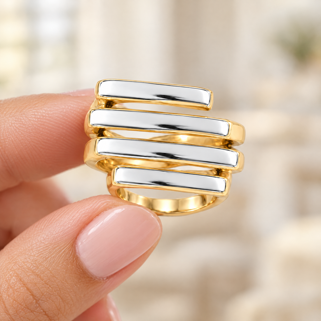 Staggered Bar Ring held in fingertips